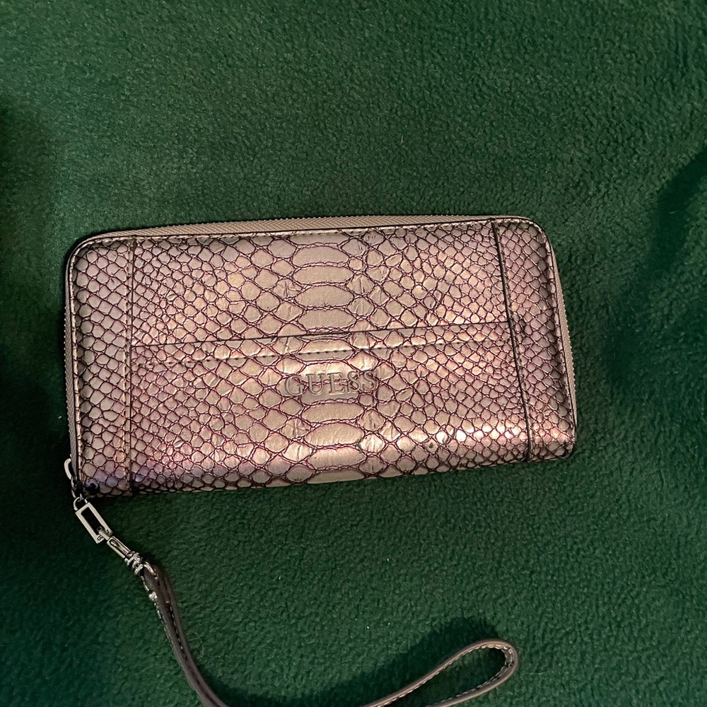 Guess silver ladies accordion wallet.